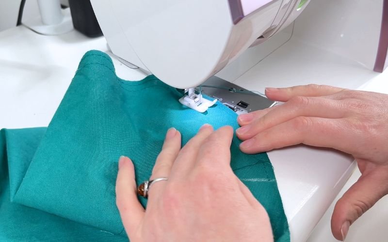 Sewing gathering stitches into sleeve crown for classic set in sleeve insertion