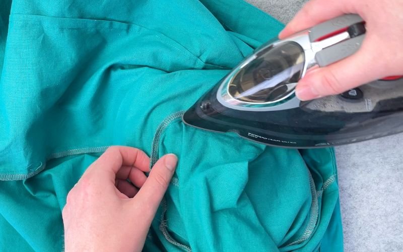 Pressing set-in sleeve seam allowance towards bodice