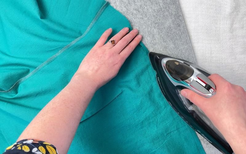 Pressing the shirt hem before topstitching