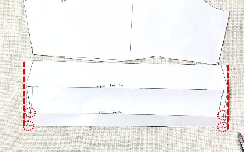 How to Draft a Roll-Up Sleeve Pattern (Step-by-Step Tutorial) Pattern markings cut on a roll-up sleeve facing