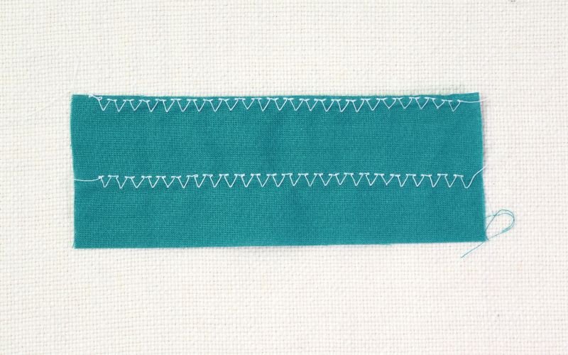 9 Basic Sewing Stitches Every Beginner Must Master Overcast stitch sample sewn on a regular sewing machine to finish raw fabric edges without an overlocker
