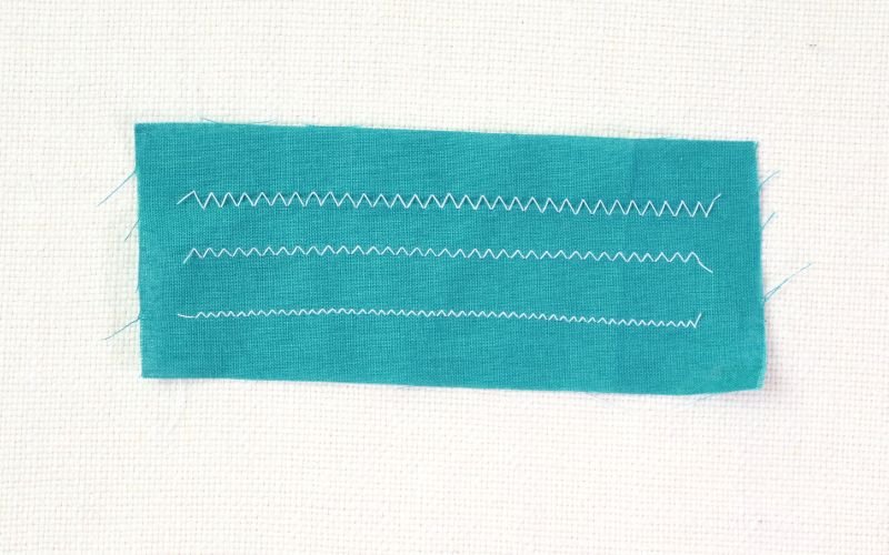 9 Basic Sewing Stitches Every Beginner Must Master Zig zag stitch sample sewn on cotton fabric showing a flexible stitch for stretch fabrics and basic sewing techniques