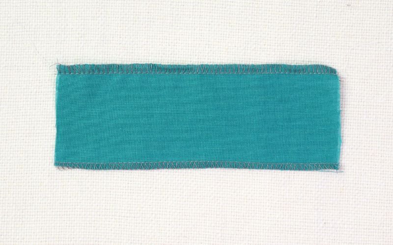 9 Basic Sewing Stitches Every Beginner Must Master Comparison of 3-thread narrow and wide overlocker stitch samples on cotton fabric