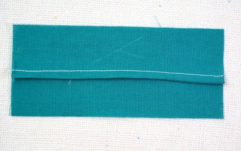 Different Types of Seam Finishes That Look Professional A photograph illustrating a classic French seam, showing the initial narrow seam inside a wider seam, resulting in a completely enclosed raw edge.