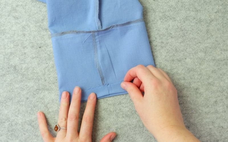 How to Sew Roll-Up Sleeves: Step-by-Step Guide Folding up and pressing in place the sleeve extension facing