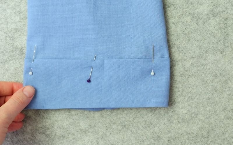 How to Sew Roll-Up Sleeves: Step-by-Step Guide Pinned and pressed sleeve extension before sewing