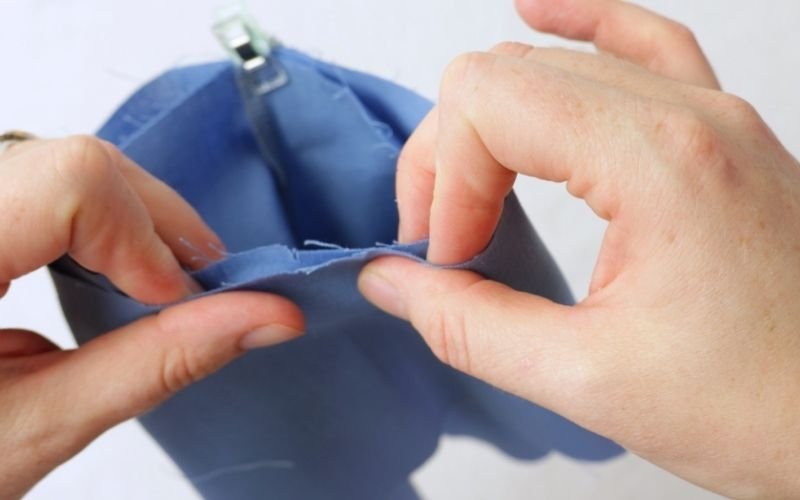 How to Sew Roll-Up Sleeves: Step-by-Step Guide Pinning a roll-up sleeve extension to the sleeve opening with right sides together